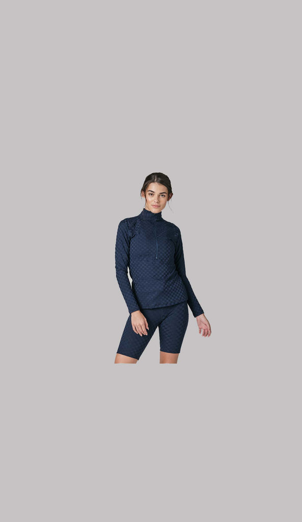 Woman wearing 925fit navy athletic wear.