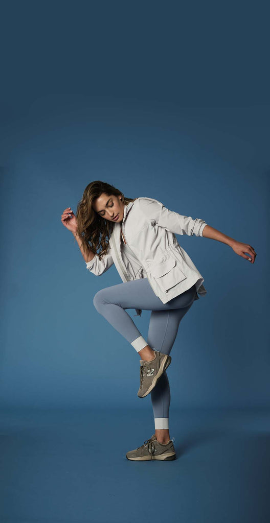 Woman wearing 925fit activewear jacket.