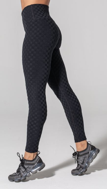 Woman is wearing 925 fit Hi & Bye Black Jacquard yoga pants.