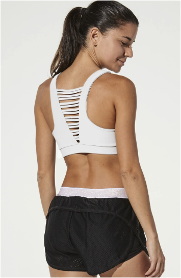 Woman is wearing 925 fit No Strings Attached White Sports Bra.