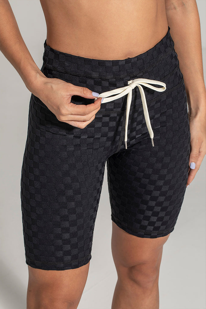 Woman wearing 925 fit Fair Square Black Jacquard athletic shorts.