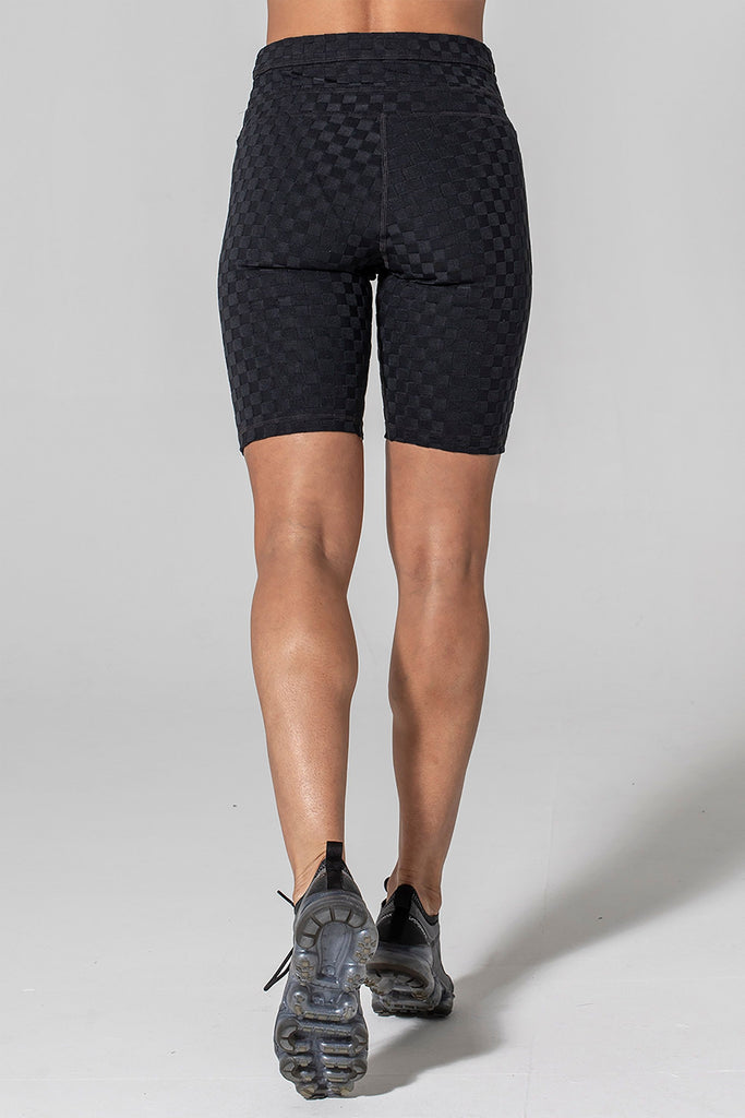 Woman wearing 925 fit Fair Square Black Jacquard athletic shorts.