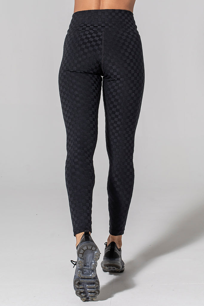 Woman is wearing 925 fit Hi & Bye Black Jacquard yoga pants.