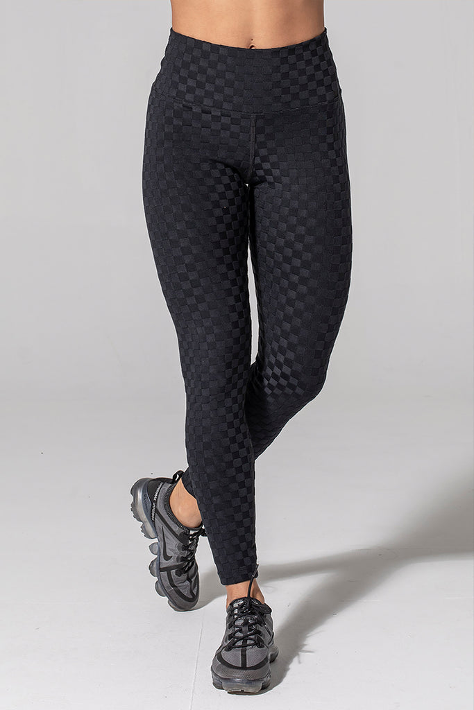 Woman is wearing 925 fit Hi & Bye Black Jacquard yoga pants.