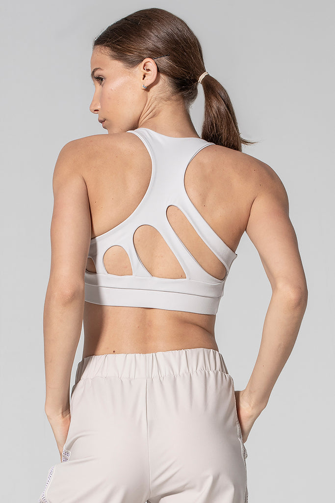 Woman is wearing 925 fit Get In Line Ash Racerback Sports Bra.