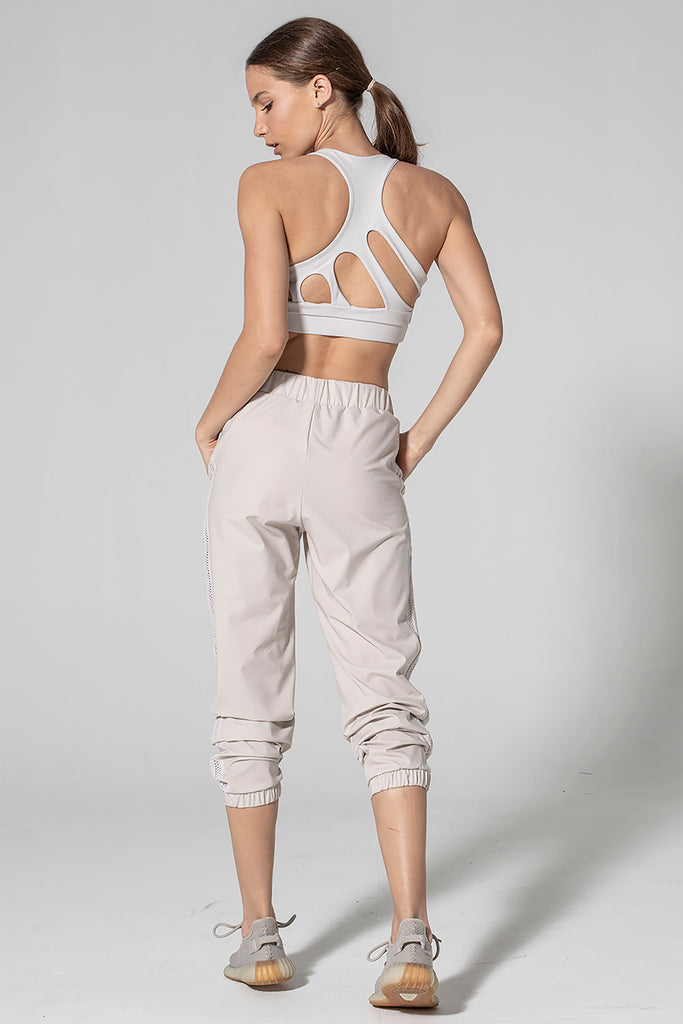 Woman is wearing 925 fit Get In Line Ash Racerback Sports Bra.