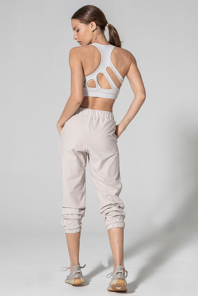 Woman is wearing 925 fit Get In Line Ash Racerback Sports Bra.