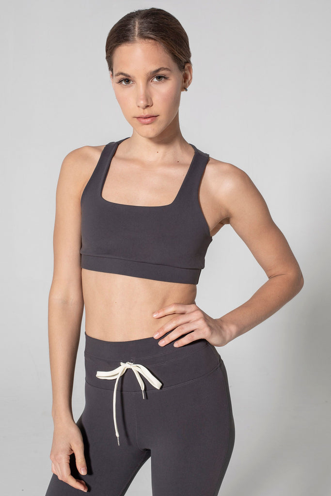 Woman is wearing 925 fit Fair & Square Slate Sports Bra.