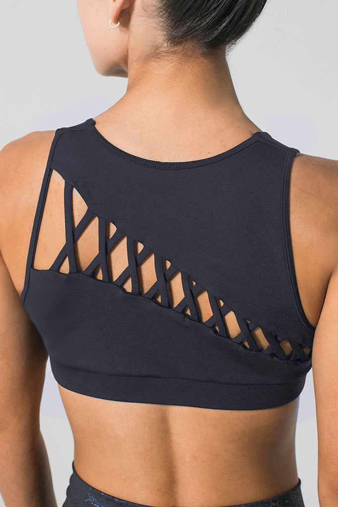 Woman is wearing 925 fit navy sports bra and navy yoga pants