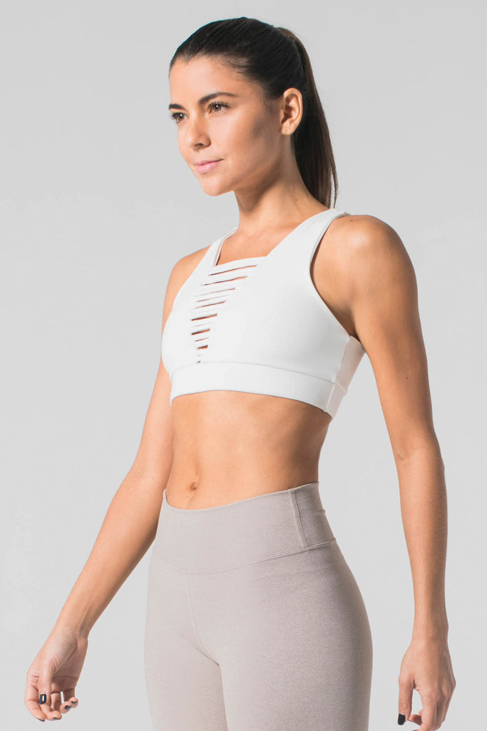 Woman is wearing 925 fit No Strings Attached White Sports Bra.