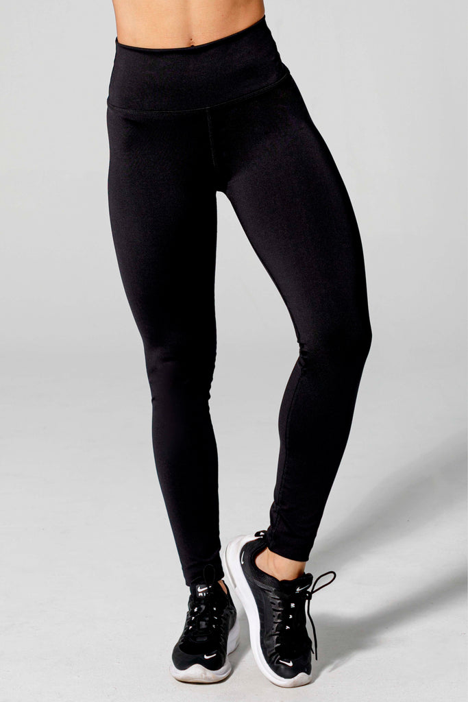 Model is wearing hi & bye black yoga pants.