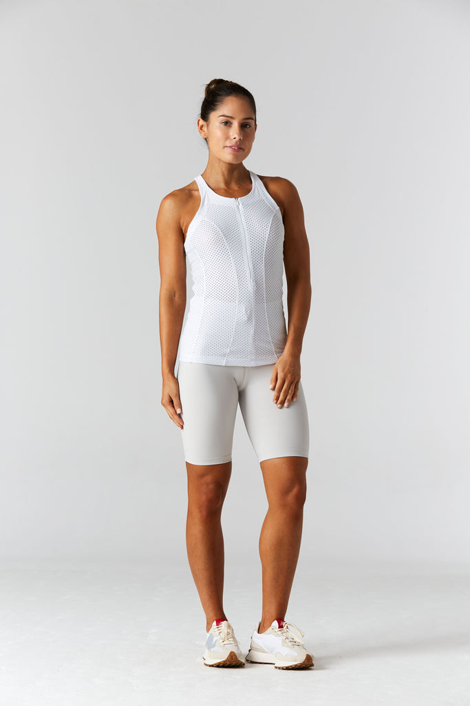 Woman is wearing 9 2 5 fit Open Minded Racerback Tank Top White Mesh