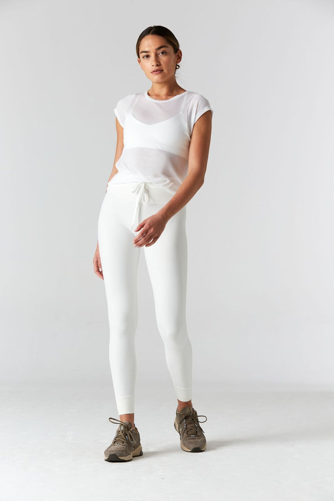 Woman is wearing 9 2 5 fit 2AT White Basic Tee