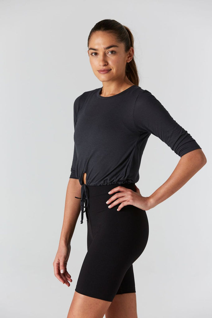 Woman is wearing 9 2 5 fit T42 Slate Crop Tee