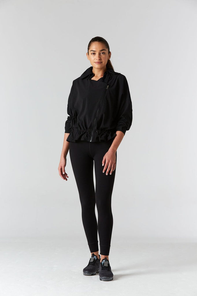 Woman is wearing 925 fit D-side black jacket.
