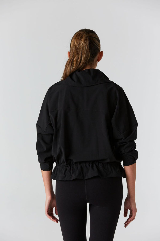 Woman is wearing 925 fit D-side black jacket.