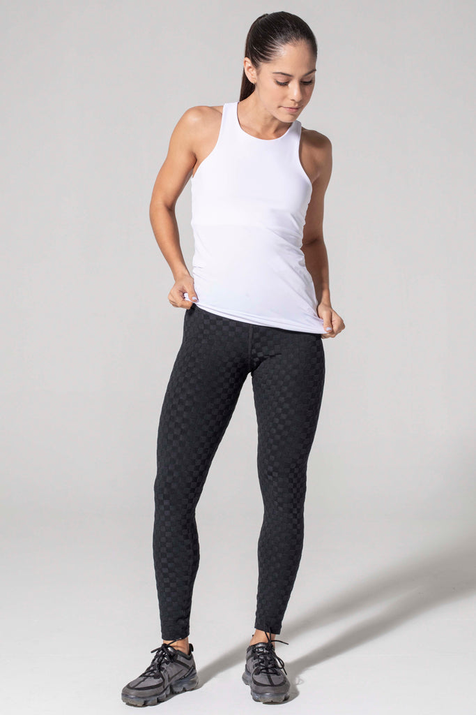 Woman is wearing 9 2 5 fit Long Story Racer Back Tank Top White