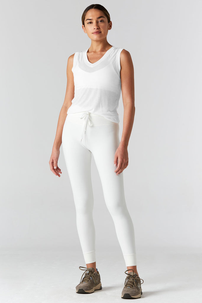 Woman is wearing 9 2 5 fit The Vine White Muscle Tee