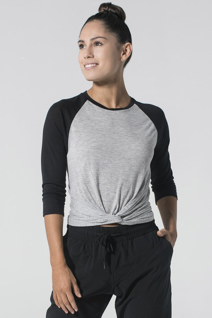 Woman is wearing 9 2 5 fit Do's & Don'ts Black and Heather Grey 3/4 length Top