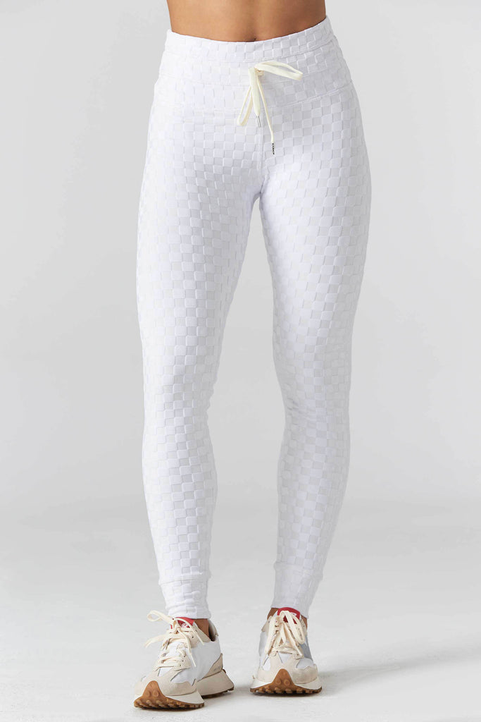 Woman wearing 925 fit Welcome Ohm White Jacquard yoga pants.