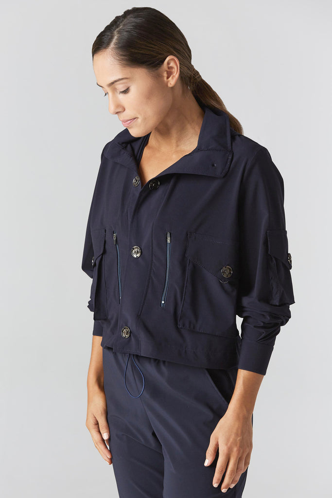 Woman is wearing 925 fit the real deal navy jacket.