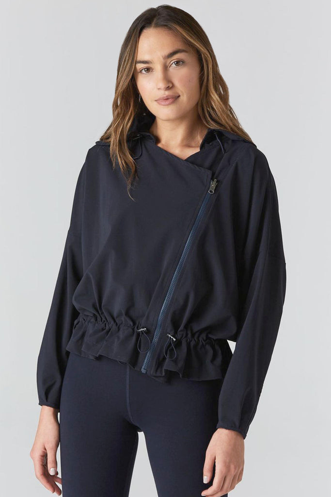 Woman is wearing 925 fit D-side navy jacket.