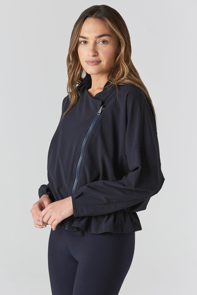 Woman is wearing 925 fit D-side navy jacket.