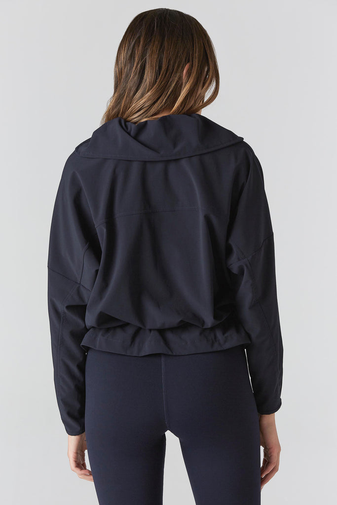 Woman is wearing 925 fit D-side navy jacket.