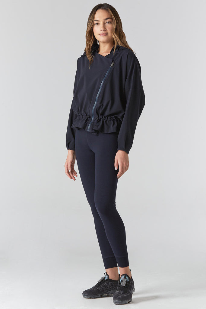 Woman is wearing 925 fit D-side navy jacket.