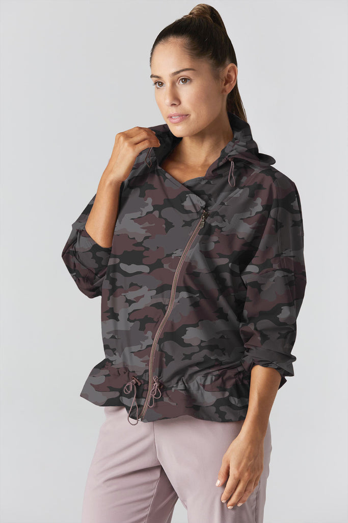 Woman is wearing 925 fit D-side camo truffle jacket.
