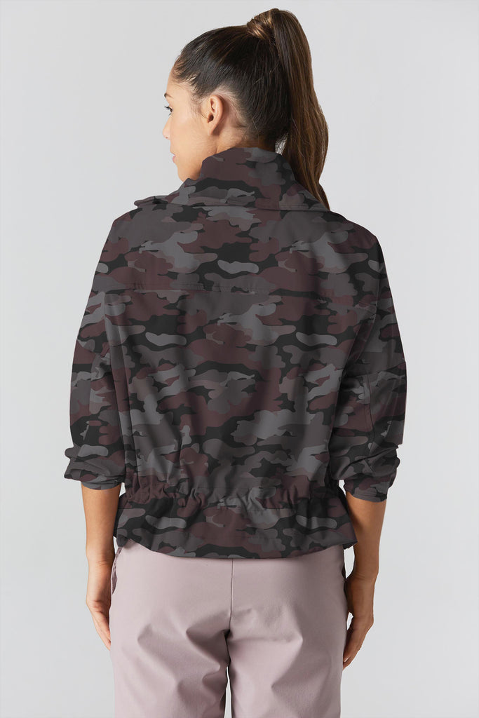 Woman is wearing 925 fit D-side camo truffle jacket.