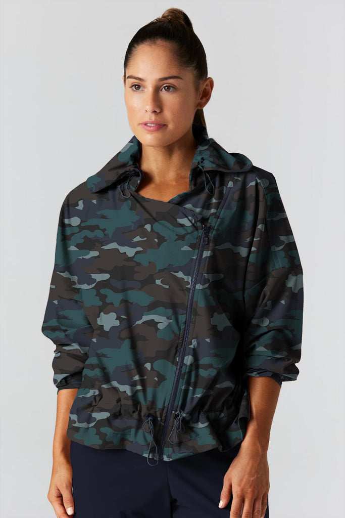 Woman is wearing 925 fit D-side camo basil jacket.