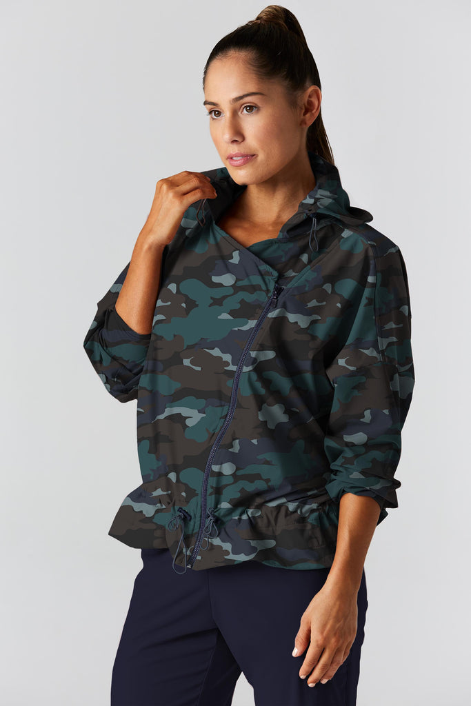 Woman is wearing 925 fit D-side camo basil jacket.