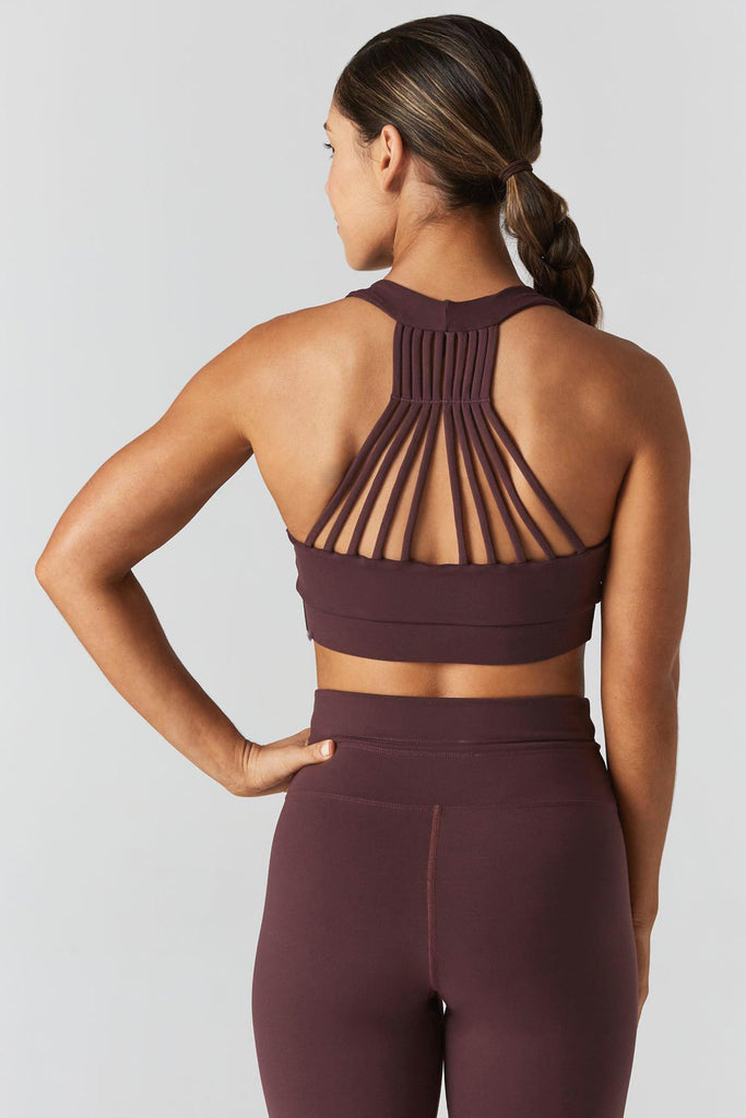 Woman is wearing 925 fit Multi task fig sports bra