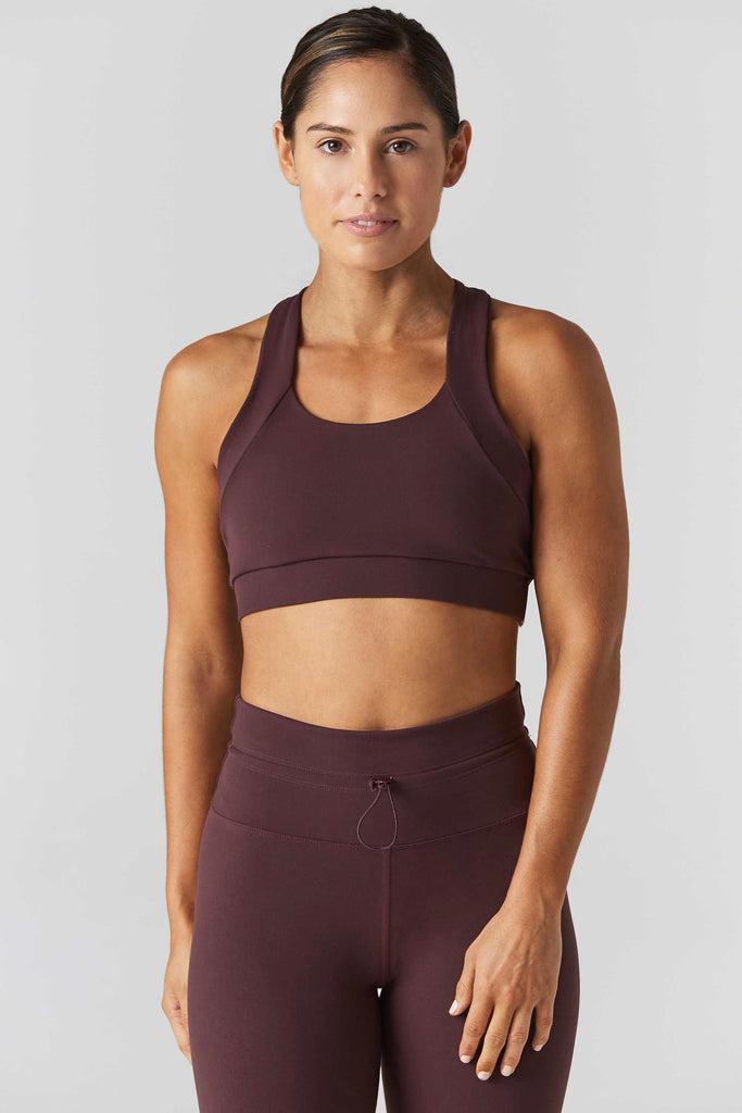 Woman is wearing 925 fit Multi task fig sports bra