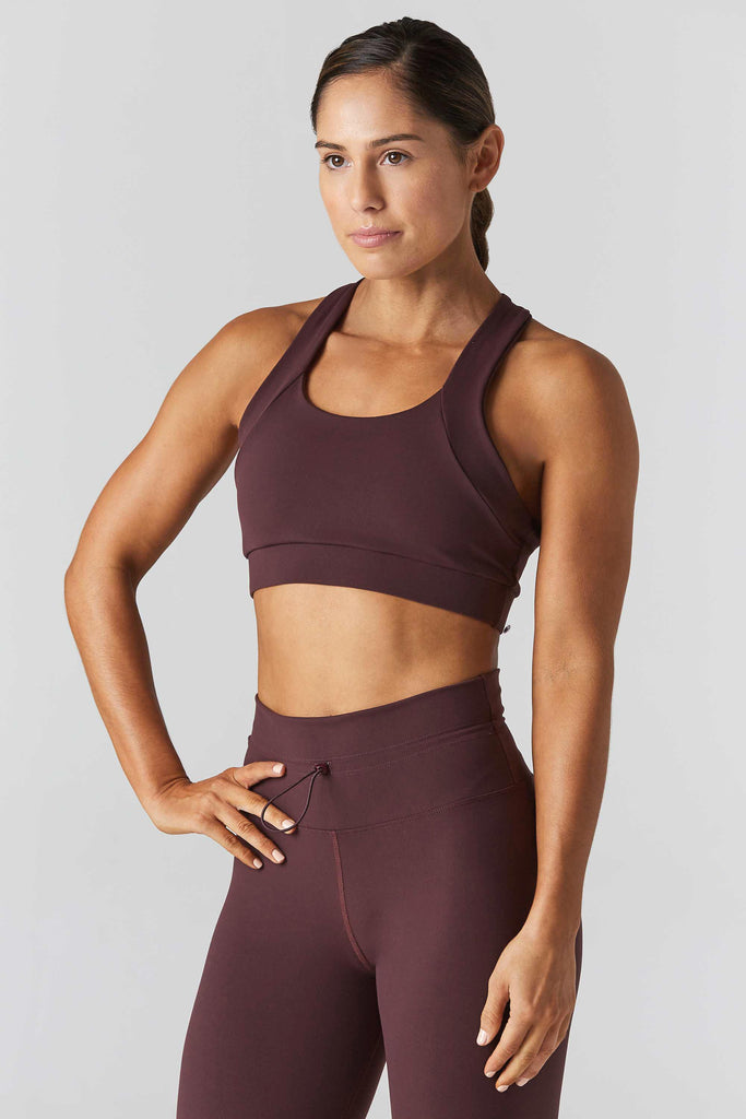 Woman is wearing 925 fit Multi task fig sports bra
