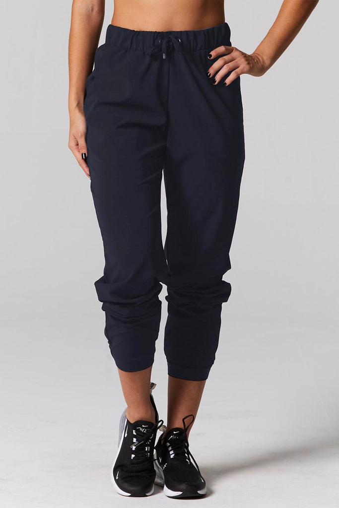 Model is wearing 925 fit No rules navy pants.