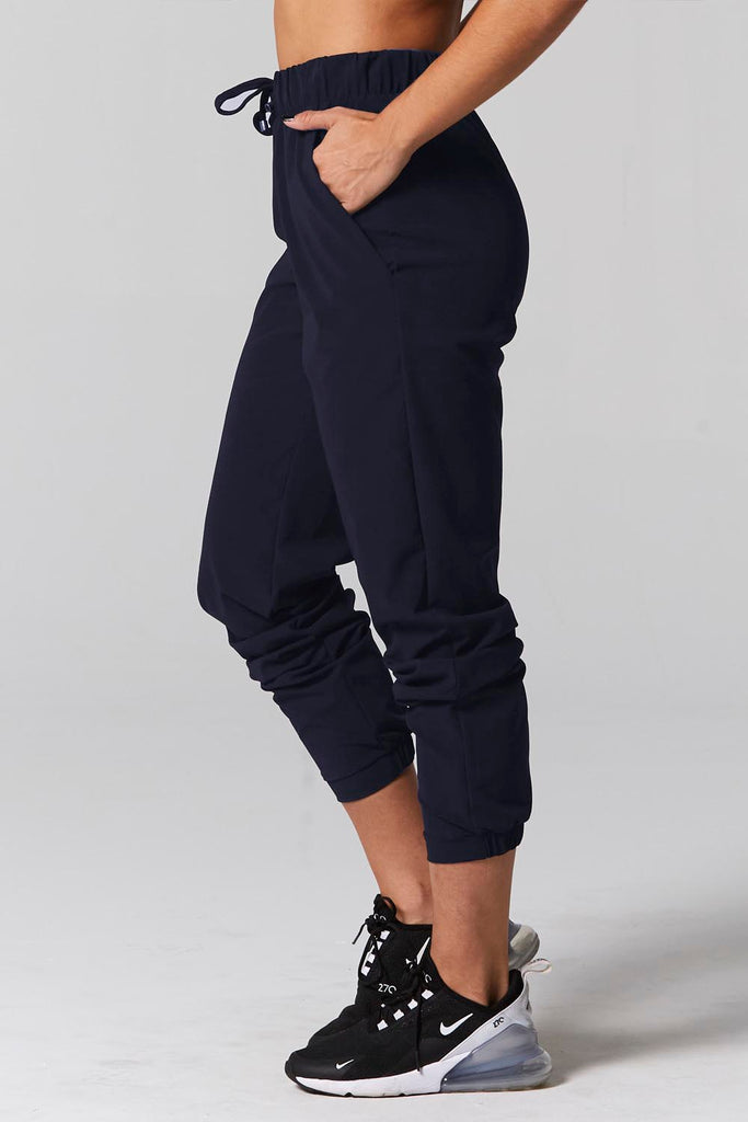 Model is wearing 925 fit No rules navy pants.