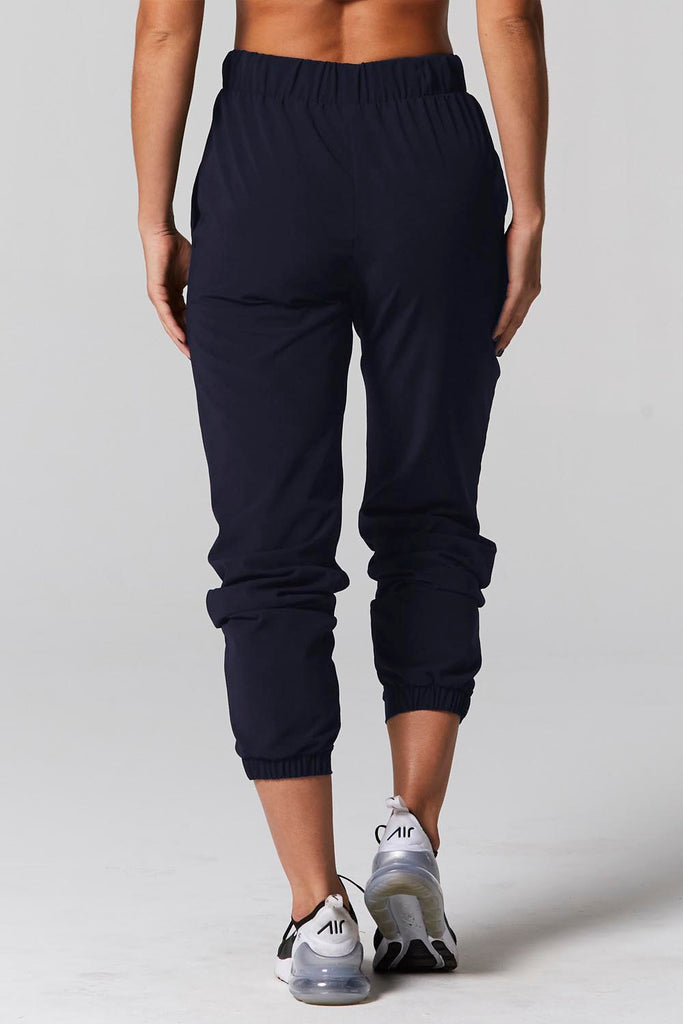 Model is wearing 925 fit No rules navy pants.